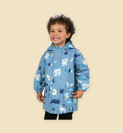 Child wearing a printed rain jacket