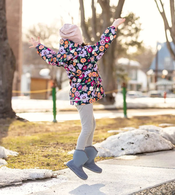 Child jumping outdoors in Jan & Jul Toasty-Dry winter boots