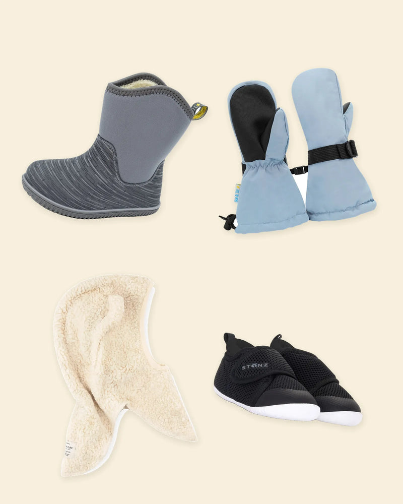 Winter boot, snow mittens, balaclava and baby shoes laid out on cream